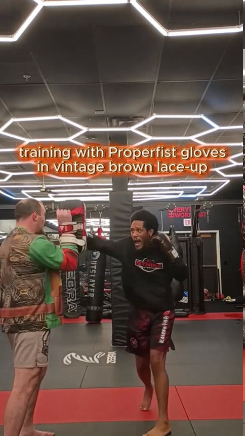 Pro MMA fighter Brandon "TriniStylz" Paguandas using Properfist gloves in vintage brown lace-up