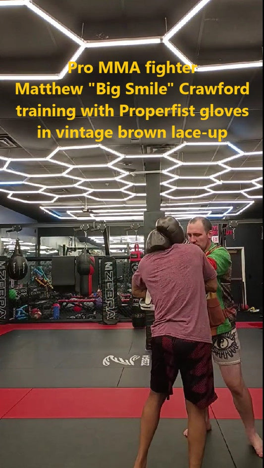 Pro MMA fighter Matthew "Big Smile" Crawford using Properfist gloves in vintage brown lace-up